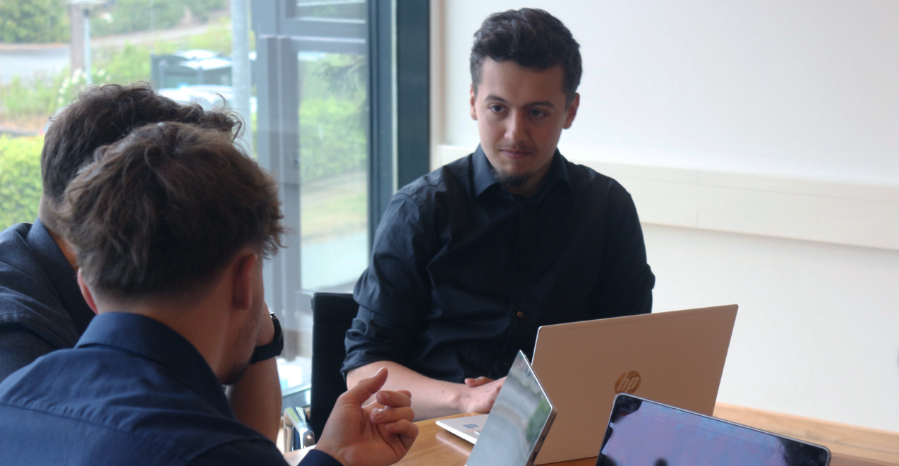 Hassan Jallouli, Copywriter at Once Advertisements, discussing business matters with Gergo Mezes, and a client.